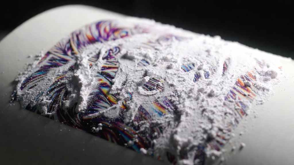 Close-up of DTF transfer film with adhesive powder before heat pressing