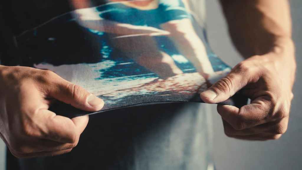 Stretch test showing flexible DTF ink on elastic sportswear fabric
